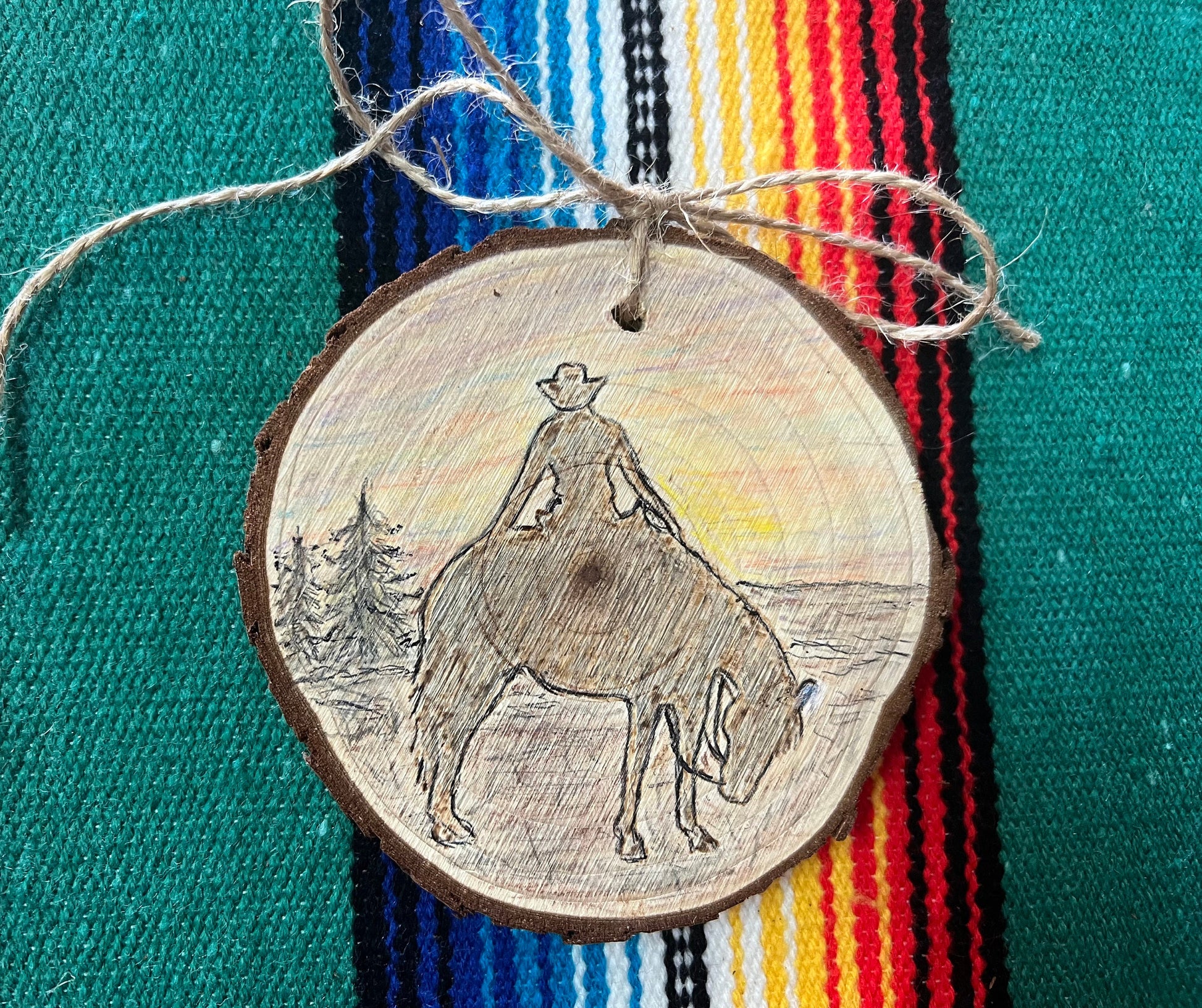 Hand Burned Sunset Cowboy Ornament on Wood